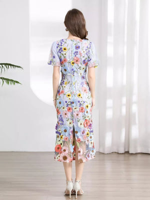 Sheath dress with short sleeves, a floral print, and a slit hem.