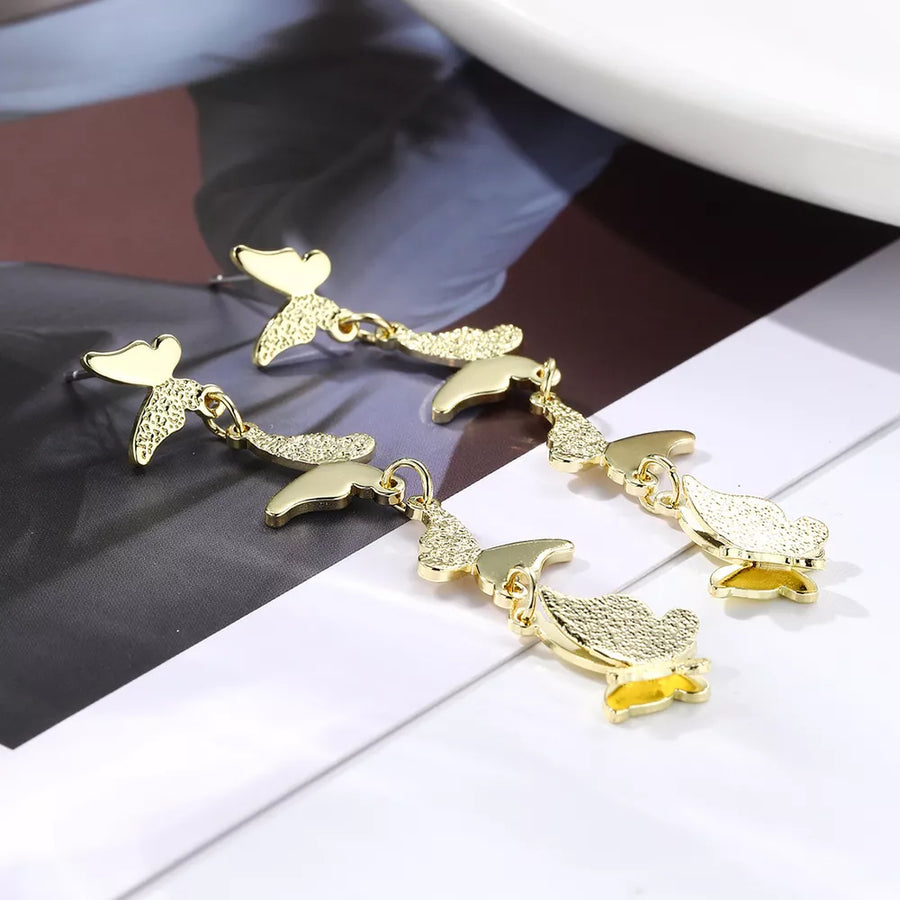 18K Gold-Plated, Alloy Care instructions: Avoid wearing during exercise, as swea earrings in gold with dangling silhouette