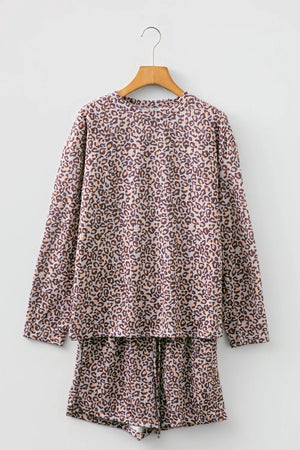 Leopard print ribbed loungewear set with long sleeve top and drawstring shorts.