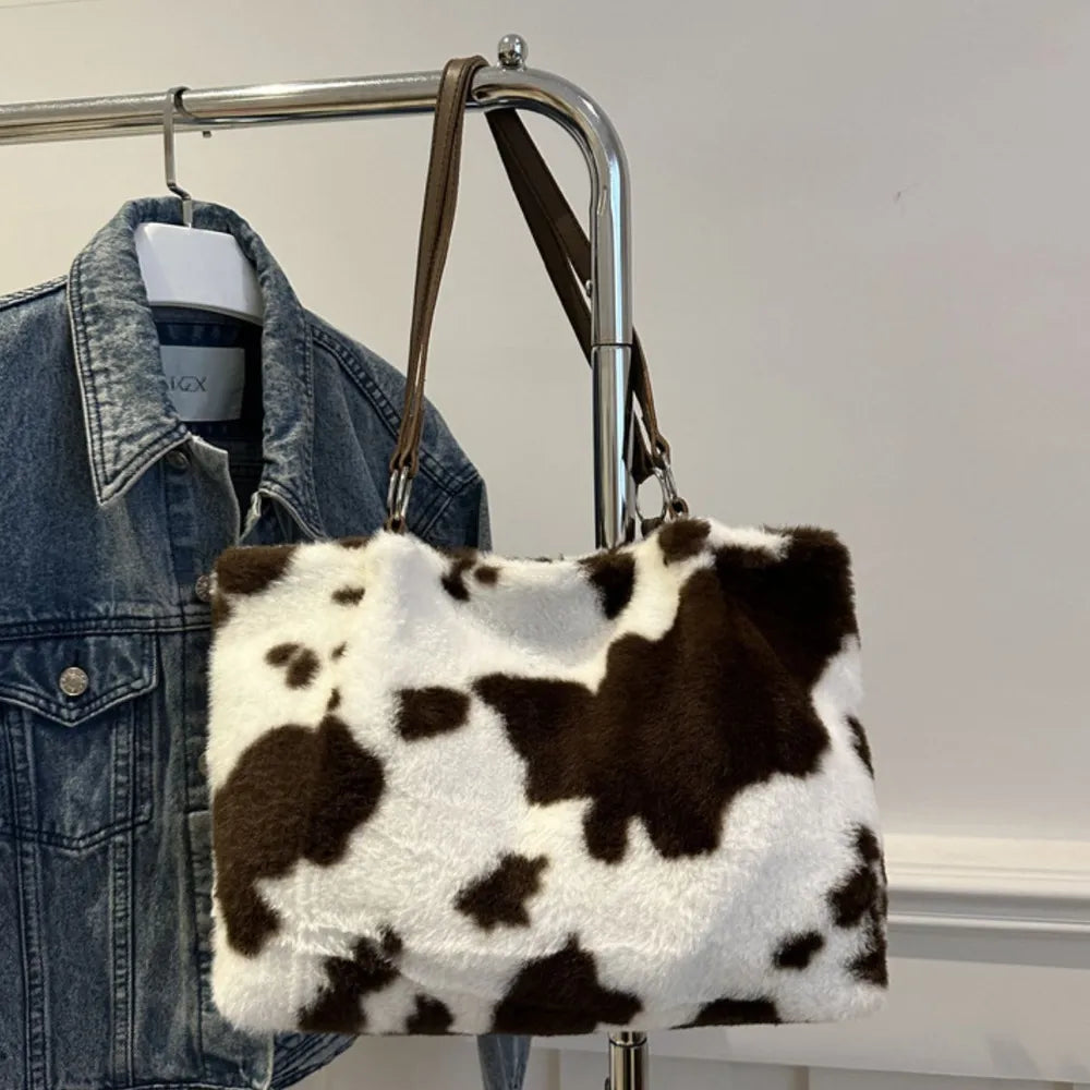 Cowhide print faux fur shopper bag with brown straps.