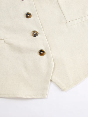 Cream cotton vest with tortoise shell buttons and pocket detail