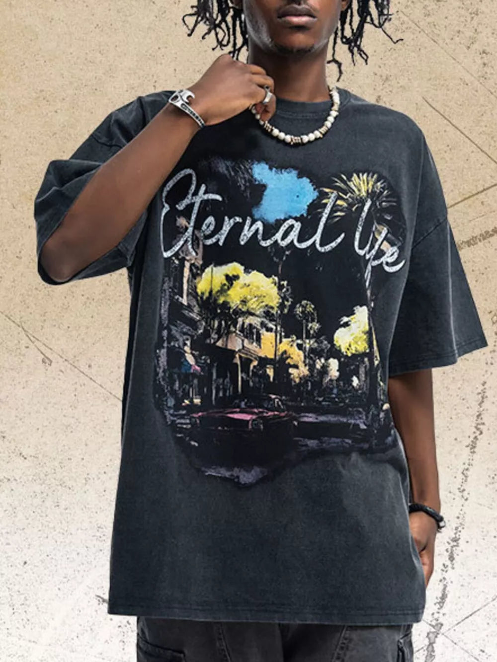 Black cotton graphic t-shirt with "Eternal Life" text and a vintage street scene graphic.