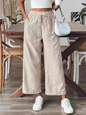 Chic high-waisted striped wide-leg pants in beige and white, with a relaxed fit.