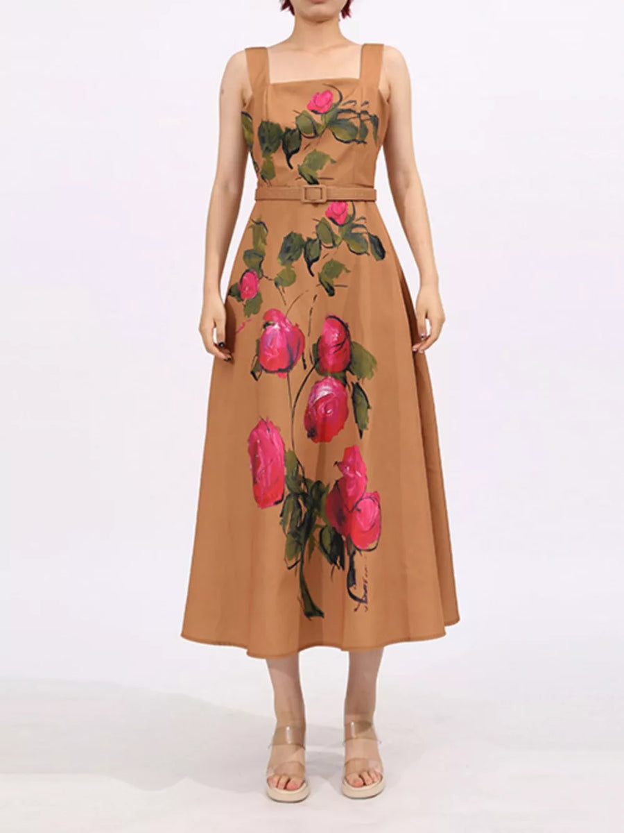 Midi dress in tan with a floral rose print, square neckline, sleeveless, and belted waist.