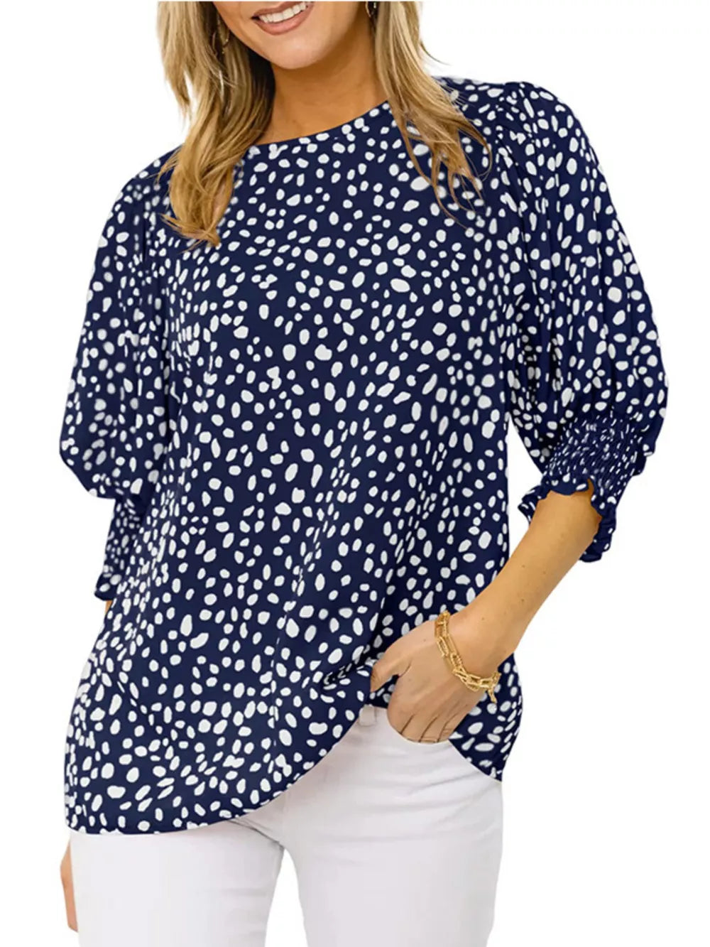 Navy blue animal print half sleeve blouse with smocked cuffs.