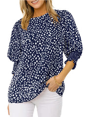 Navy blue animal print half sleeve blouse with smocked cuffs.