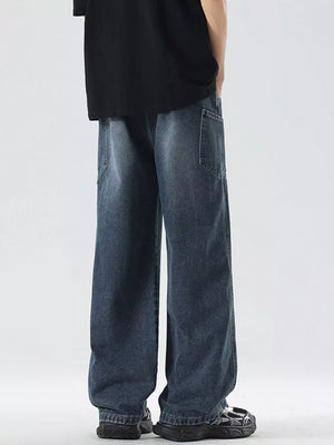 Oversized wide-leg jeans in blue denim with a drawstring waist and relaxed fit.