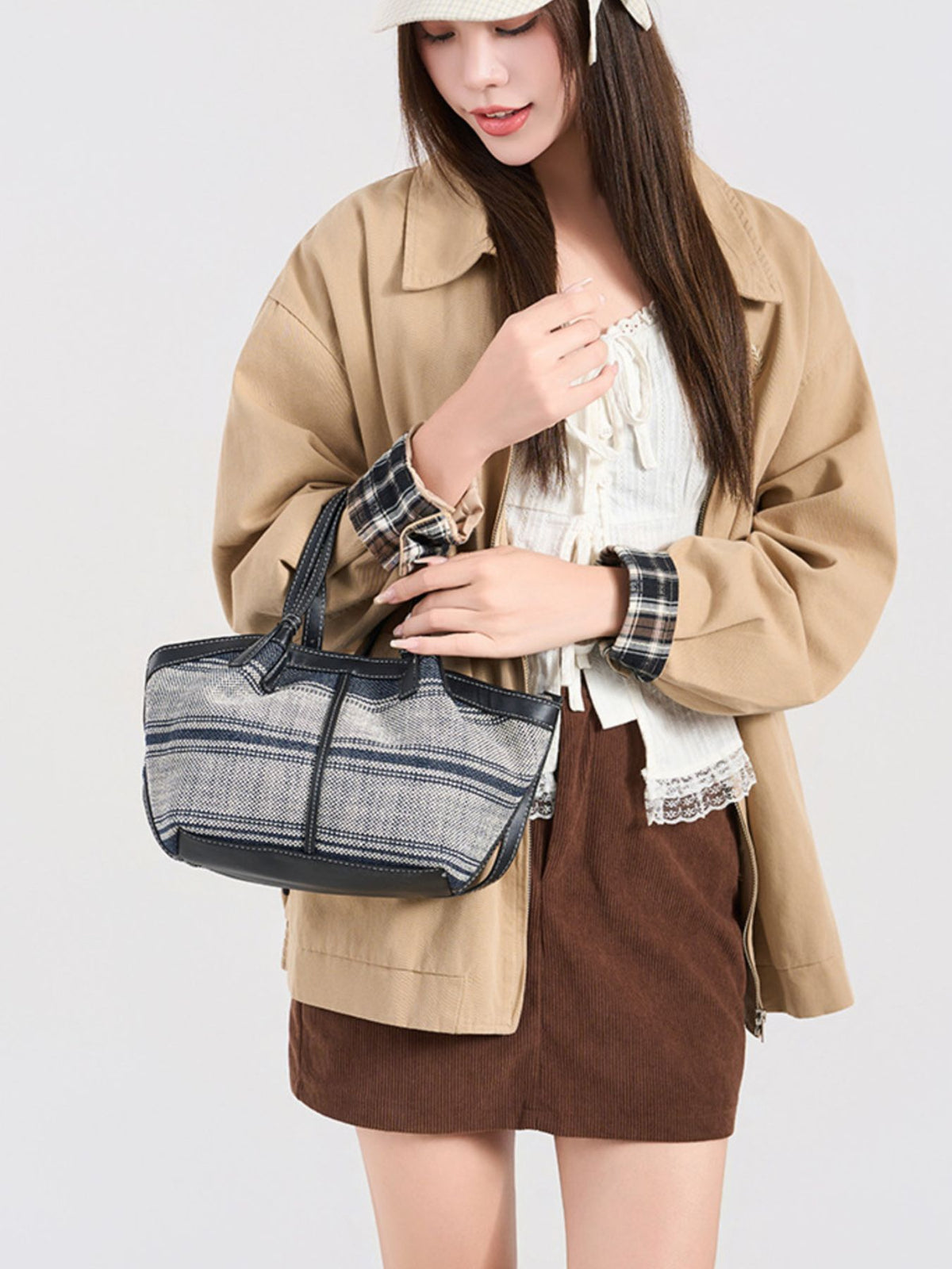 crossbody bag in gray featuring leather trim and boxy fit