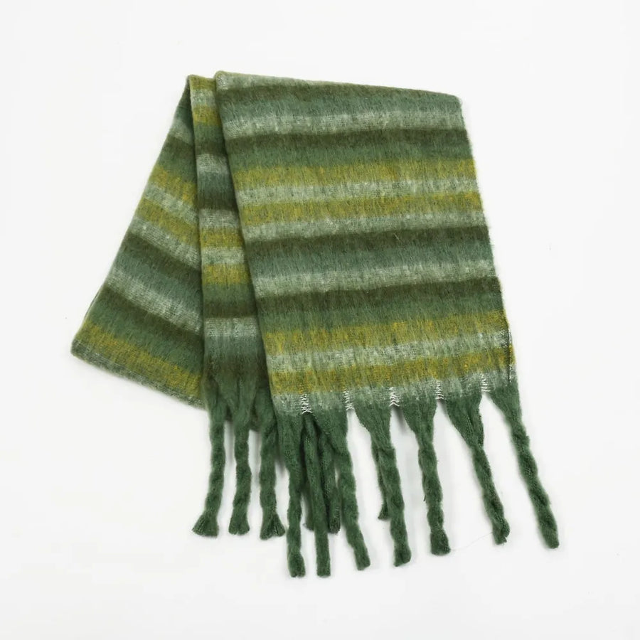 Textured stripe scarf in dark green with fringe detail and soft fuzzy texture.