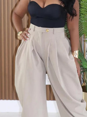 Light Khaki high-waisted pants with sculptural pleats and a gold button detail.