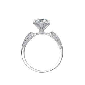 Moissanite sterling silver ring with diamond accents and intricate detailing.