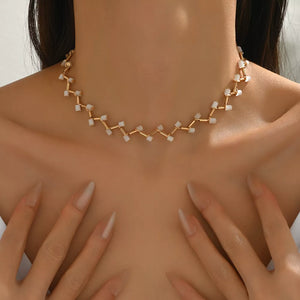 white necklace featuring 18K gold-plated and branch-like