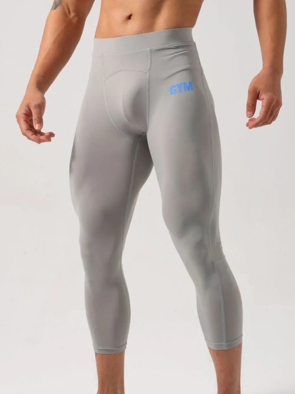 Gray compression capri leggings with blue GYM logo