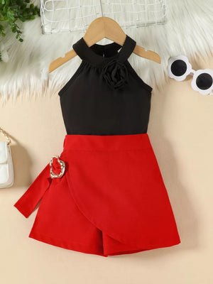 Black halter top with rose applique and red skort with buckle detail