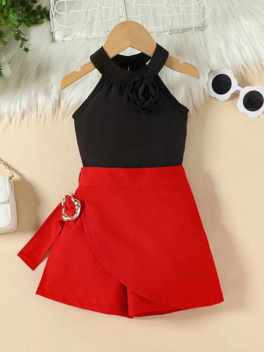 Black halter top with rose applique and red skort with buckle detail