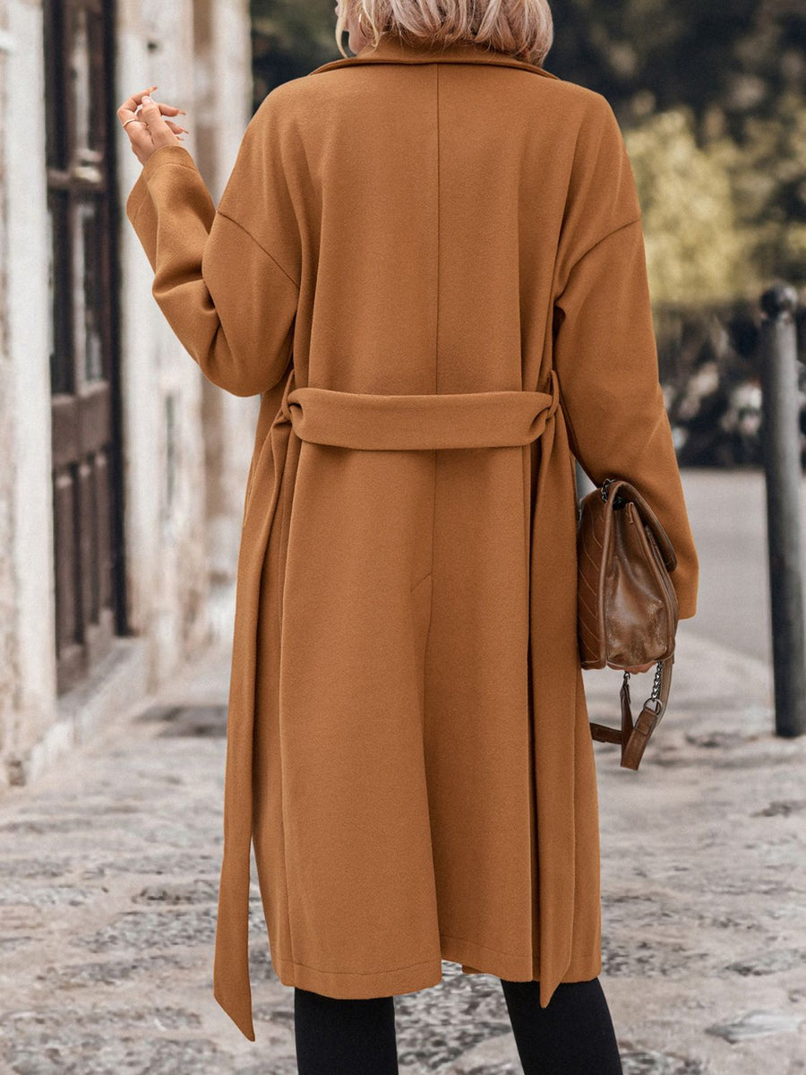 Caramel wrap-front wool blend overcoat with self-tie belt and wide lapels.