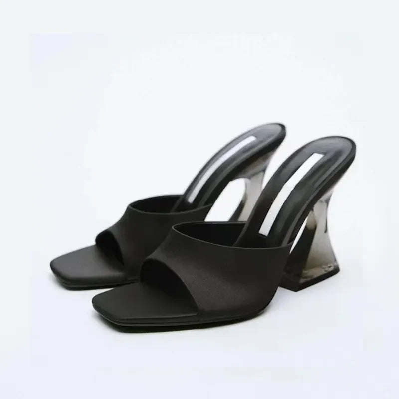Black satin mules with square toe and clear sculpted heel