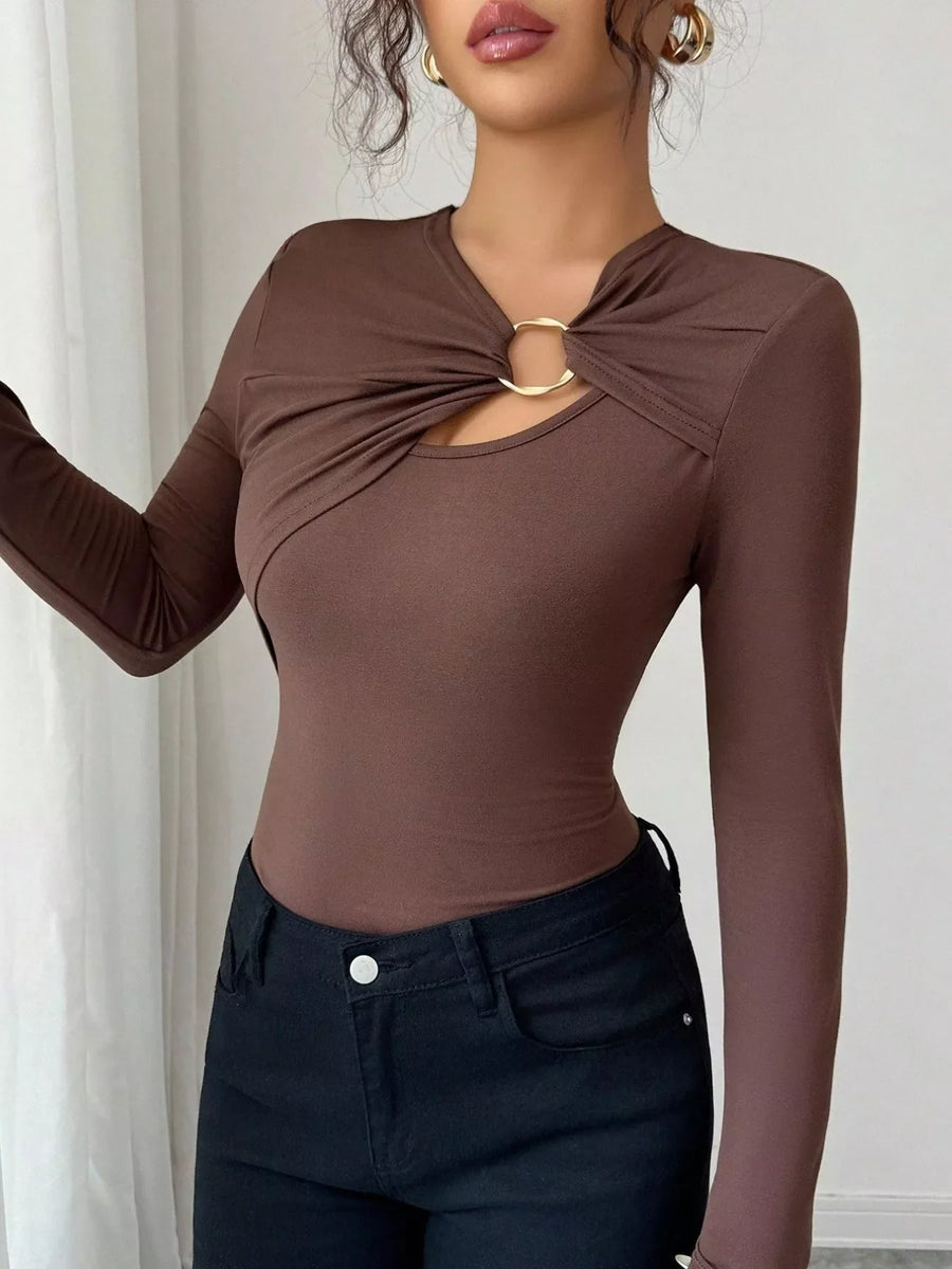 Brown long-sleeve tee with asymmetrical cutout and gold ring detail