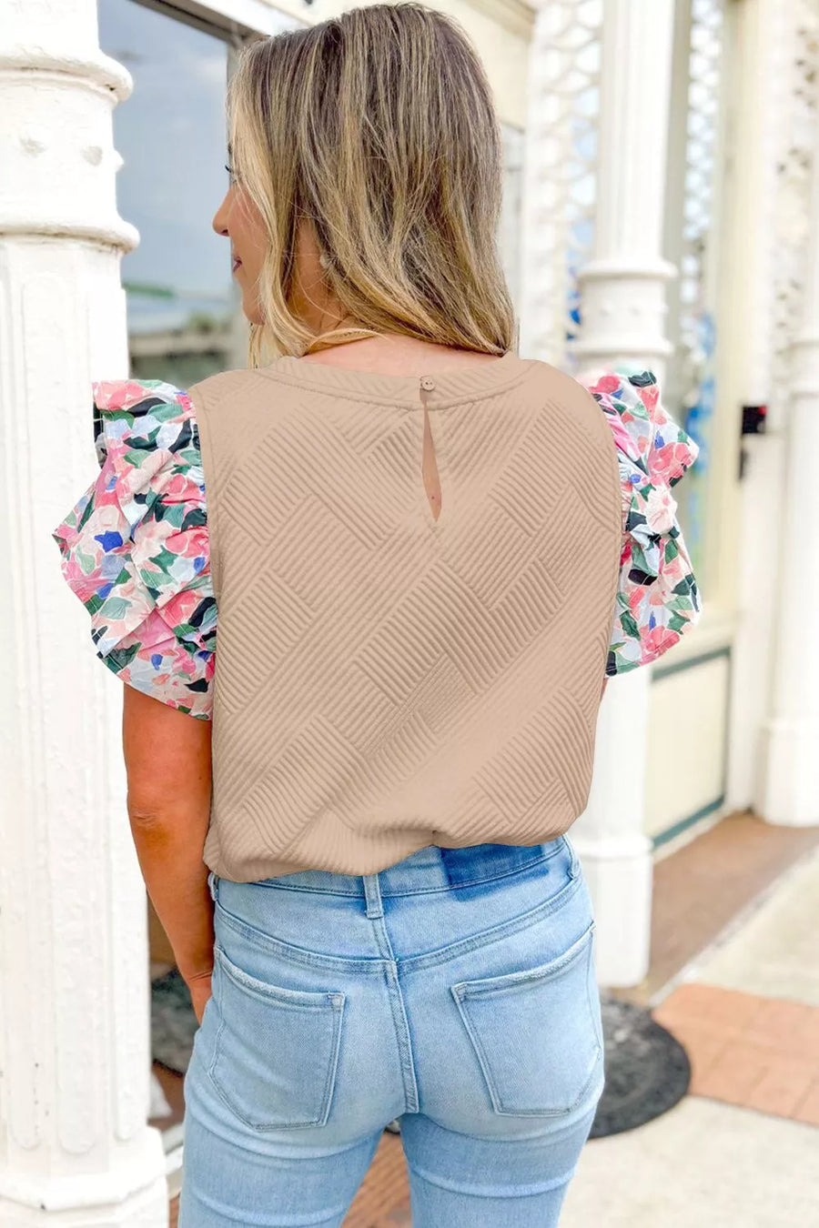Beige geometric textured shirt with floral flutter sleeves and a keyhole back detail.