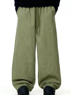 Army green relaxed wide-leg drawstring trousers with pockets and a comfortable fit.