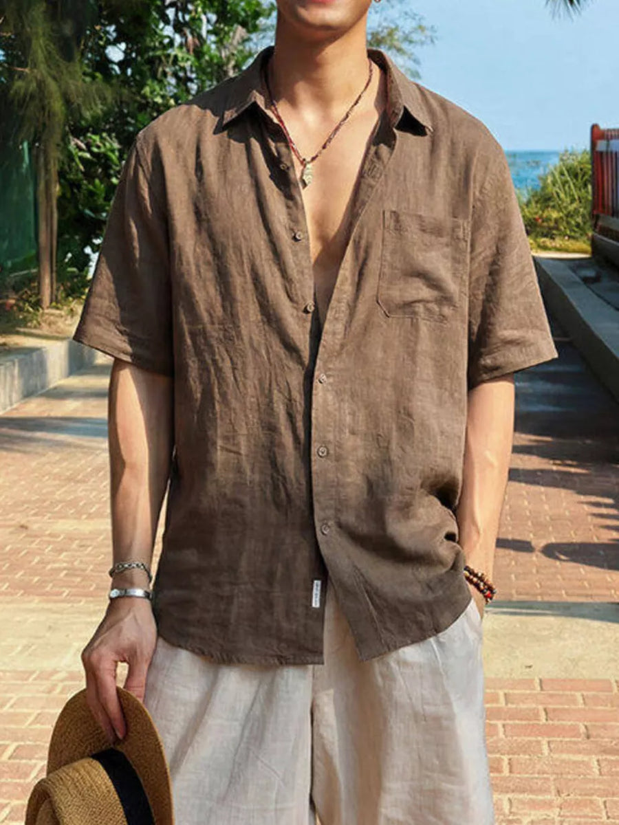 Brown relaxed fit buttoned casual shirt with short sleeves and a chest pocket.