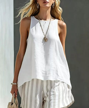 White sleeveless linen blend tank top with round neckline and striped linen blend shorts.