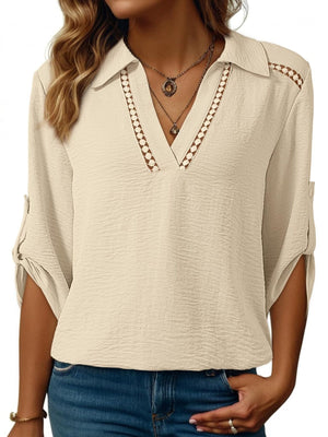 Apricot crinkled texture shirt with Johnny collar, V-neck, and roll-tab sleeves.
