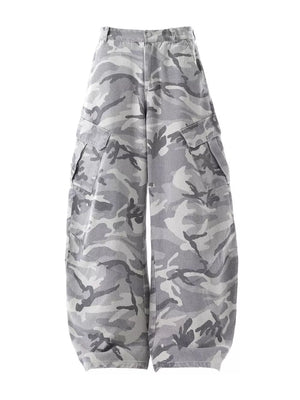 Baggy white camouflage cargo pants with button fly and multiple pockets.