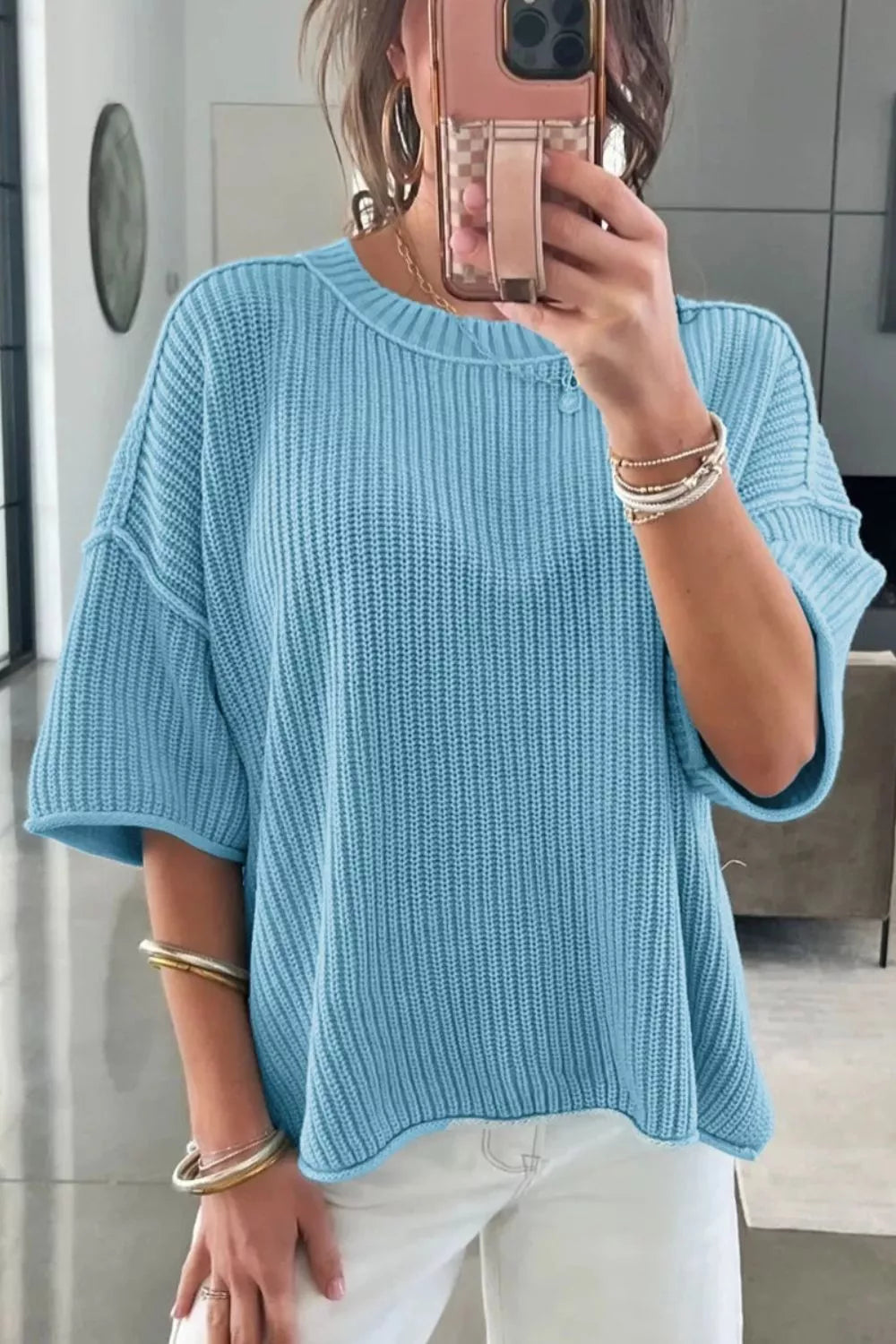 Relaxed ribbed knit sweater top in blue with short sleeves and a crew neck.