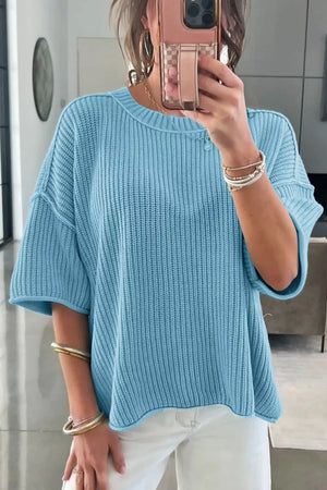 Relaxed ribbed knit sweater top in blue with short sleeves and a crew neck.