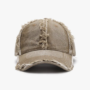 Distressed denim baseball cap in Khaki with frayed edges and a raw hem detail.
