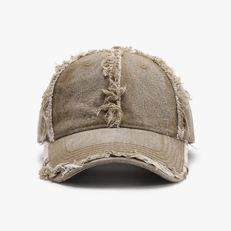 Distressed denim baseball cap in Khaki with frayed edges and a raw hem detail.