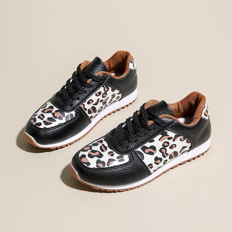 Black and caramel leopard print panel sneakers with lace-up closure.