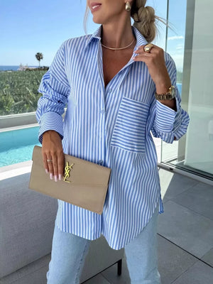 Blue button-up shirt with tunic-length and button-front