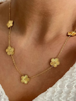 necklace in gold featuring delicate floral charms and straight fit
