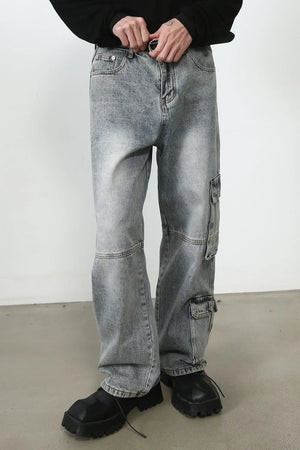 Medium wash baggy cargo jeans with distressed details and multiple pockets.