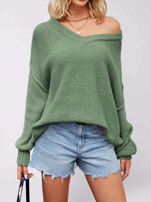 100% Acrylic Care instructions: Machine wash cold v-neck sweater in Apricot with loose silhouette