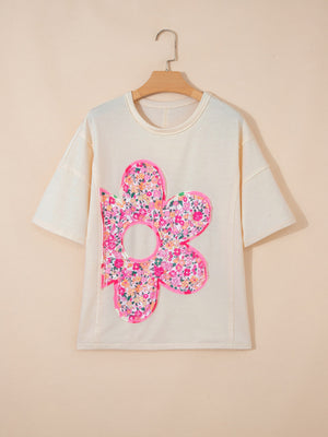 Cream cotton t-shirt with oversized floral chenille patch and crew neck.