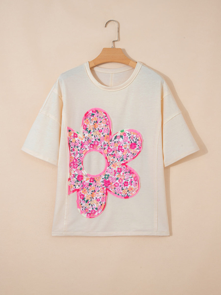 Cream cotton t-shirt with oversized floral chenille patch and crew neck.
