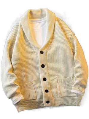 Beige ribbed knit cardigan with shawl collar, button front, and patch pockets.