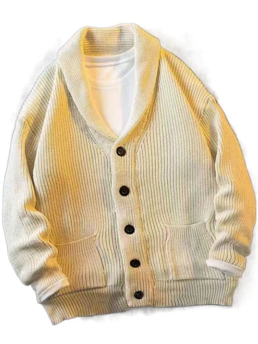 Beige ribbed knit cardigan with shawl collar, button front, and patch pockets.