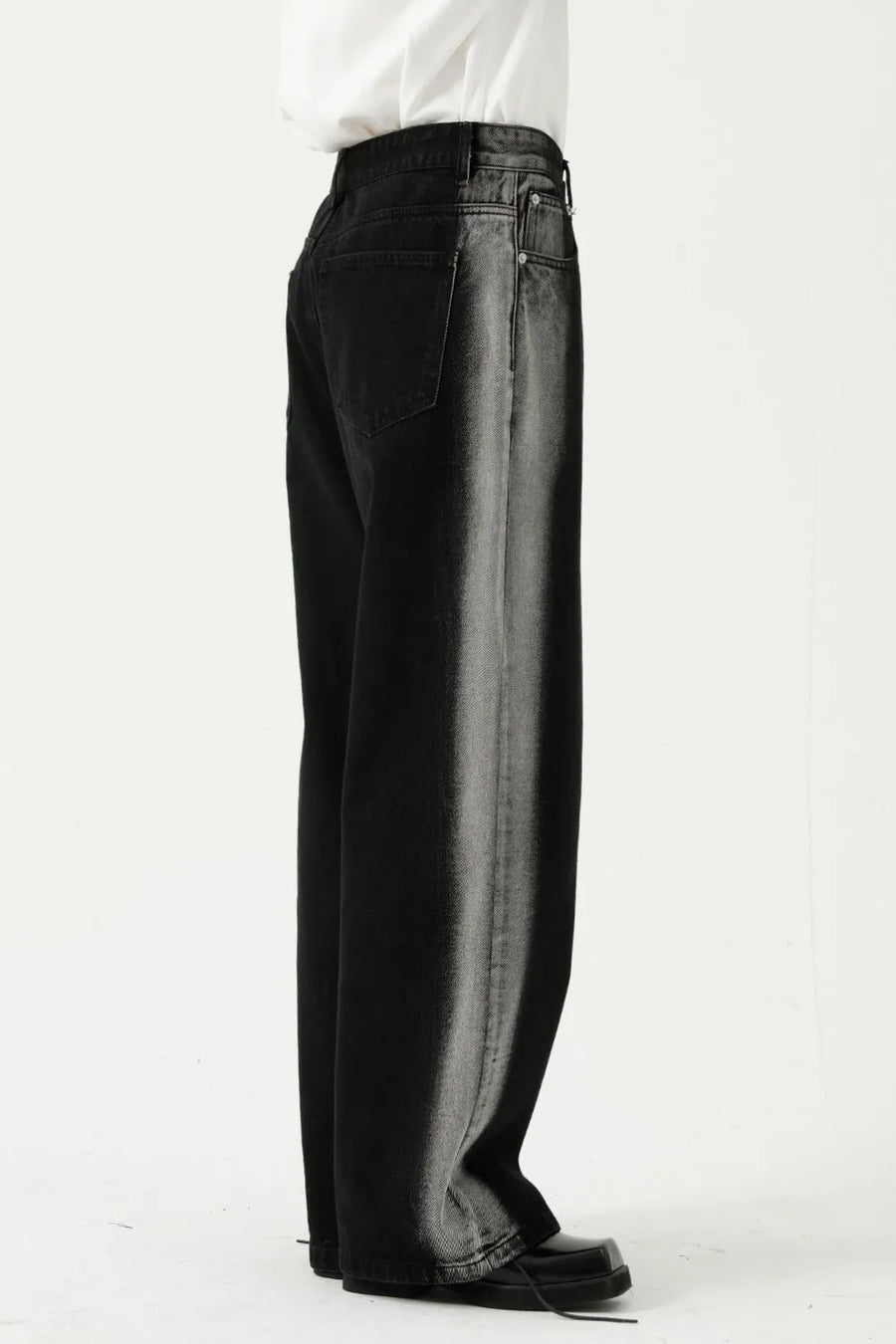 Dark wide leg jeans with faded side panels and a relaxed fit.