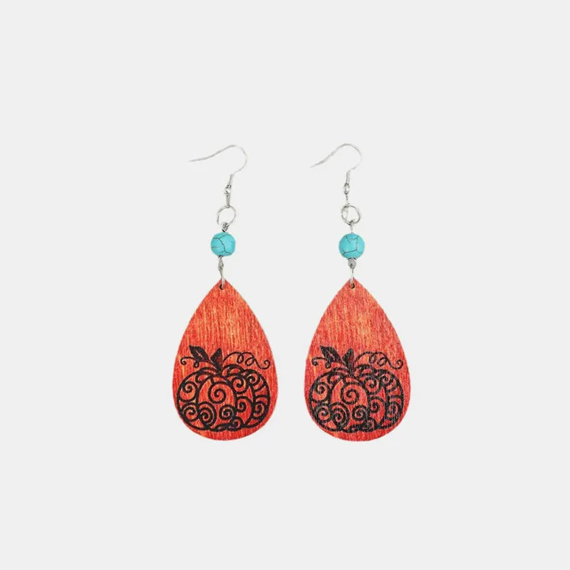 Autumnal pumpkin wood dangle earrings with turquoise beads and silver hooks.