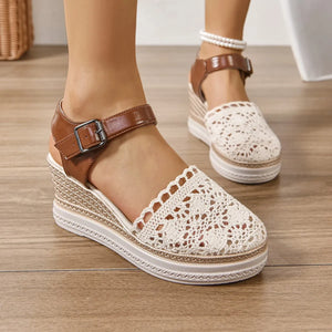 Beige crochet and leather wedge ankle strap sandals with buckle closure.