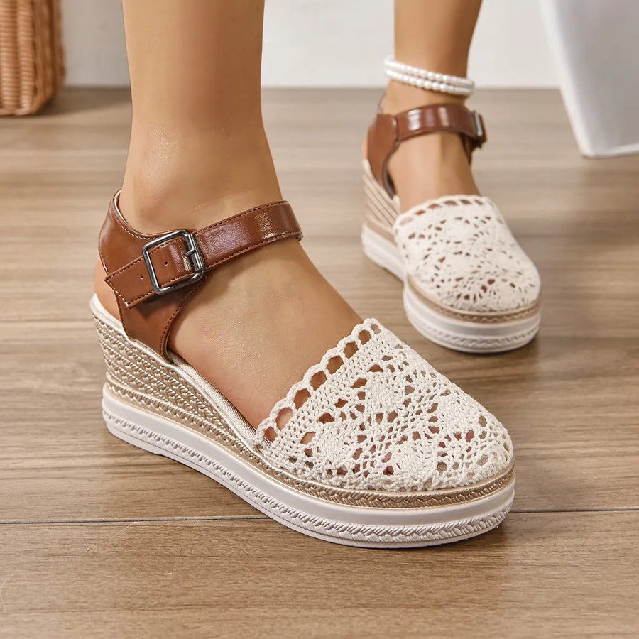 Beige crochet and leather wedge ankle strap sandals with buckle closure.
