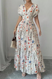 Maxi dress with floral print, V-neck, flutter sleeves, and pleated skirt.