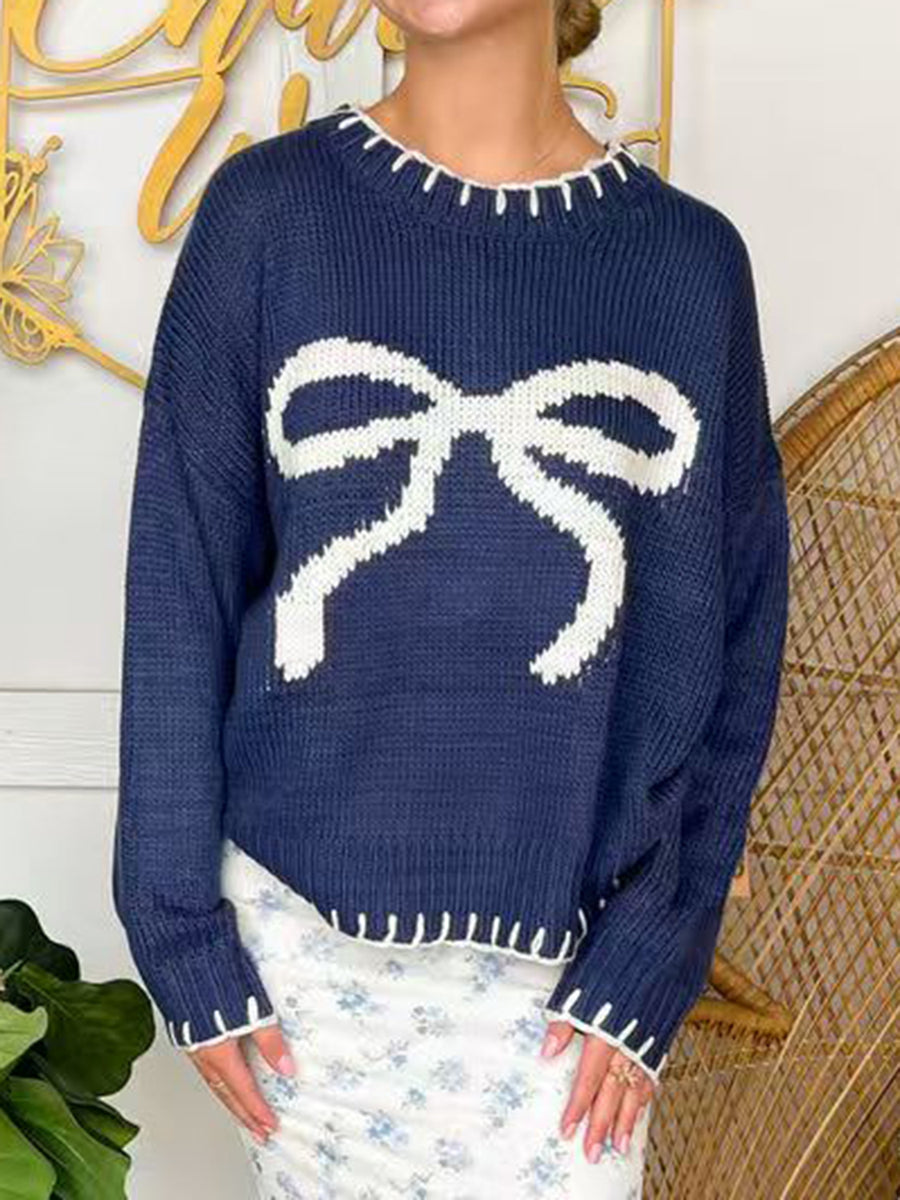 Navy acrylic knit sweater with white bow detail and contrast stitching.