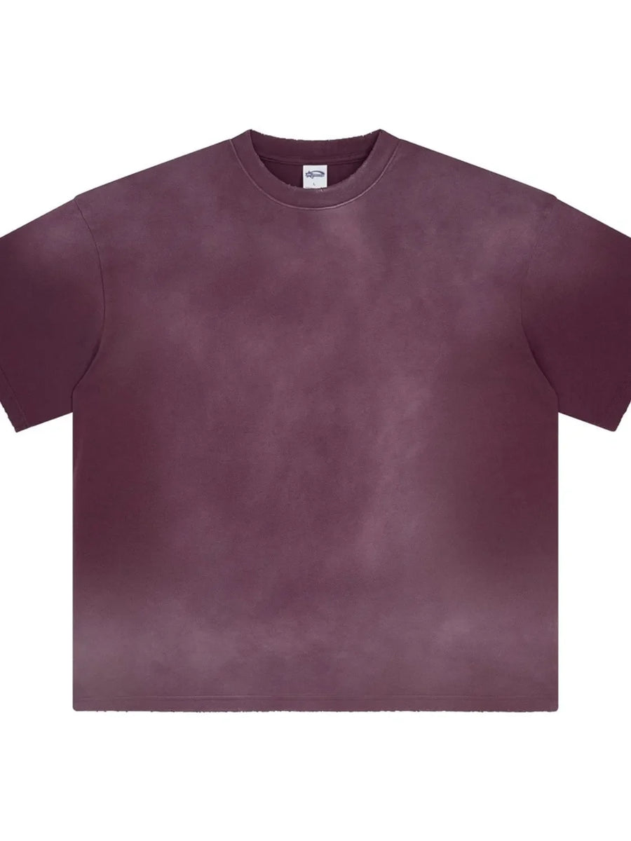 Oversized washed cotton crewneck tee in plum purple with a faded, textured look.