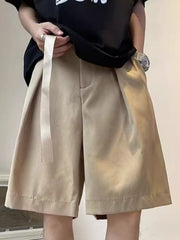 Men's khaki loose-fit casual shorts with pockets and a belt detail