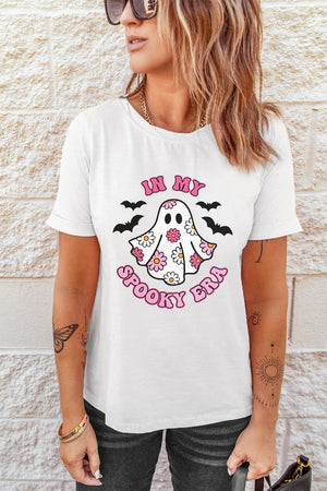 White graphic t-shirt with a floral ghost and bats design that says "In My Spooky Era".